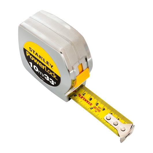 Stanley 33-463 PowerLock tape measure, 10m/33ft, silver case, yellow blade, angled view with white background.
