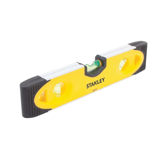 Stanley yellow and black spirit level with three vials, angled view on white background