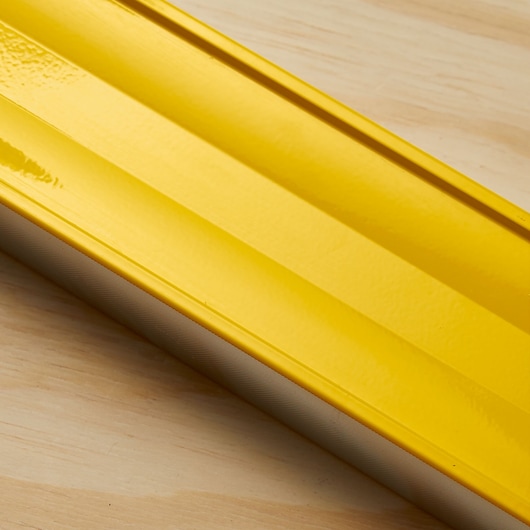 STANLEY 43-572 yellow level tool, side angle, showing aluminum body and smooth finish.