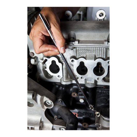 STANLEY 78-021 magnetic pickup tool held by hand near engine parts, close-up photography.