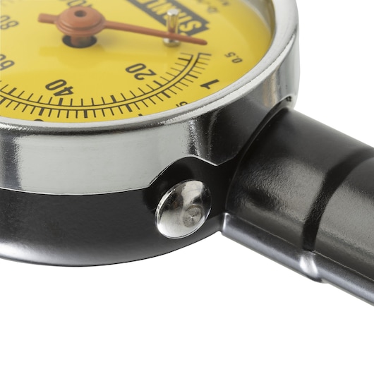 Close-up photo of STANLEY 79-052 tire pressure gauge with yellow dial and black metal body, front angle.