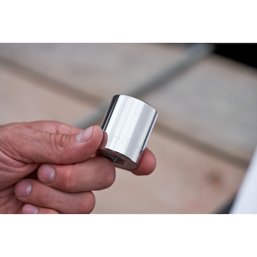 Photo of STANLEY STMT82672-0 chrome socket from ratchet and socket set held in hand.