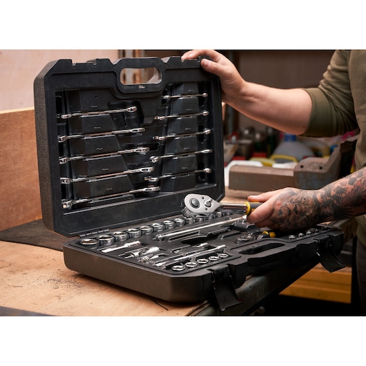 STANLEY STMT82832-1 ratchet, socket, and combination wrench set with accessories, 41 pieces, open case on workbench.