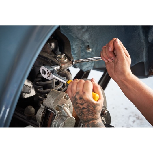 Photo of STANLEY STMT82832-LA ratchet wrench being used for automotive repair.