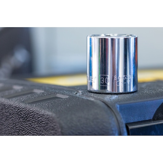 STANLEY STMT82832-LA 30mm chrome socket close-up on textured black surface, product photography.