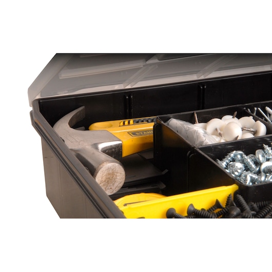 STANLEY STST14026 toolbox interior with yellow hammer, screws, and assorted hardware, close-up angle.