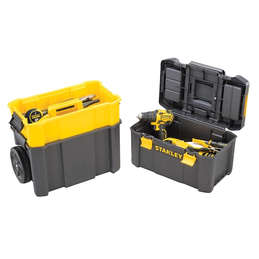 Stanley toolboxes on white background, one with wheels and hand tools, one open showing power tools inside