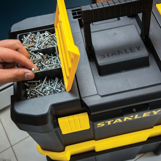STANLEY STST18631 black and yellow toolbox photography, top view with open compartment holding screws.