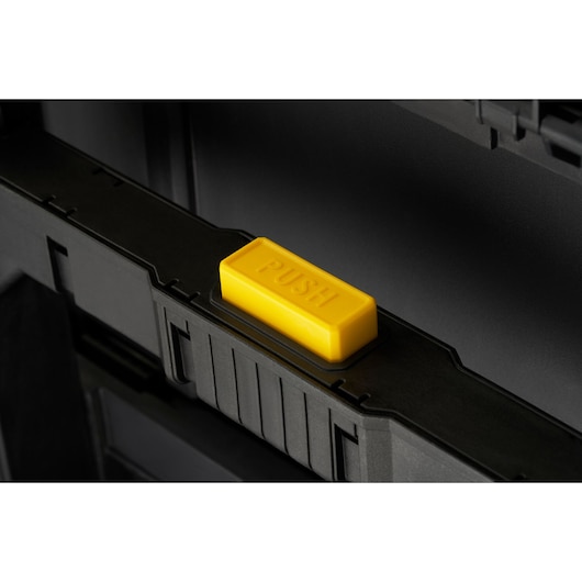 STANLEY STST83319-1 toolbox latch with yellow push button, close-up angle.